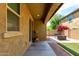 Enjoy this covered back patio featuring a water well, brick accents and artificial turf at 1202 E Binner Dr, Chandler, AZ 85225