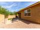 A quaint backyard featuring brick accents, and an outdoor seating area with a gas firepit at 1202 E Binner Dr, Chandler, AZ 85225
