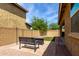 A quaint backyard featuring brick accents, and an outdoor seating area with a gas firepit at 1202 E Binner Dr, Chandler, AZ 85225