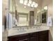 Bright bathroom featuring double sinks with a dark wooden vanity and stylish fixtures at 1202 E Binner Dr, Chandler, AZ 85225