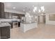 Modern kitchen featuring stainless steel appliances, granite countertops, and a central island at 1202 E Binner Dr, Chandler, AZ 85225