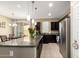 Spacious kitchen with a granite island, stainless steel appliances, and an adjacent dining area at 1202 E Binner Dr, Chandler, AZ 85225