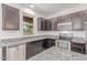 Close-up of kitchen with stainless steel appliances, granite counters, and natural light at 1202 E Binner Dr, Chandler, AZ 85225