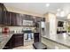 Well-equipped kitchen with stainless steel appliances, granite counters, and ample cabinet space at 1202 E Binner Dr, Chandler, AZ 85225