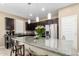 Kitchen featuring dark cabinets, granite countertops, stainless steel appliances, and a spacious island at 1202 E Binner Dr, Chandler, AZ 85225