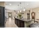 Modern kitchen featuring a large island, stainless steel appliances, and an open view to the living area at 1202 E Binner Dr, Chandler, AZ 85225