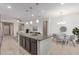 Modern kitchen island and adjacent dining area flooded with natural light, perfect for entertaining at 1202 E Binner Dr, Chandler, AZ 85225