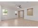 Bright living room with neutral tile flooring, ceiling fan, and natural light at 1202 E Binner Dr, Chandler, AZ 85225