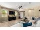 Comfortable living room with a large TV, neutral tones, and an inviting sectional sofa at 1202 E Binner Dr, Chandler, AZ 85225