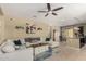 Bright living room featuring a sectional sofa, ceiling fan, and an open layout to the dining area at 1202 E Binner Dr, Chandler, AZ 85225