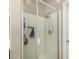 The large shower features clear glass doors, shelving and a modern shower head at 1202 E Binner Dr, Chandler, AZ 85225