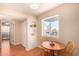 Cozy dining area with built-in shelving and a bright window overlooking the neighborhood at 12221 W Bell Rd # 362, Surprise, AZ 85378