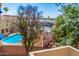 A high angle view of a blue community pool surrounded by the building at 12221 W Bell Rd # 362, Surprise, AZ 85378