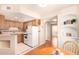Functional kitchen with wood cabinets, tiled countertops, and modern appliances at 12221 W Bell Rd # 362, Surprise, AZ 85378