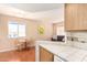 Open floor plan with a view from the kitchen into the dining and living area at 12221 W Bell Rd # 362, Surprise, AZ 85378