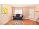 Inviting living room featuring a comfortable sofa, stylish rug, and bright natural light at 12221 W Bell Rd # 362, Surprise, AZ 85378