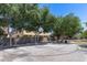 Outdoor basketball court near residential buildings, featuring a picnic table and garbage can for convenience at 1265 S Aaron -- # 277, Mesa, AZ 85209