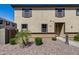 Two-story stucco home with brown trim, shutters and desert landscaping at 1265 S Aaron -- # 277, Mesa, AZ 85209