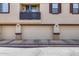Attached garages enhance this townhome with neutral doors and dark trim detail at 1265 S Aaron -- # 277, Mesa, AZ 85209