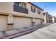 Attached garages enhance this townhome with neutral doors and dark trim detail at 1265 S Aaron -- # 277, Mesa, AZ 85209