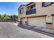 Attached garages enhance this townhome with neutral doors and dark trim detail at 1265 S Aaron -- # 277, Mesa, AZ 85209
