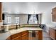 Kitchen features wood cabinetry and tiled floors at 1265 S Aaron -- # 277, Mesa, AZ 85209