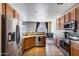 Spacious kitchen with stainless steel appliances, tile floors, and an eat-in dining area at 1265 S Aaron -- # 277, Mesa, AZ 85209