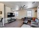 Spacious living room with large sectional, ceiling fan, and neutral walls create a cozy feel at 1265 S Aaron -- # 277, Mesa, AZ 85209