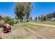 Backyard features a seating area with a charming wicker chair and views of the golf course at 1289 Leisure World --, Mesa, AZ 85206