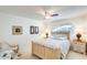 Bedroom with a ceiling fan, bright window, and a comfortable bed at 1289 Leisure World --, Mesa, AZ 85206