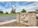 Stone community sign with ''Coyote Run'' lettering, highlighting the attractive landscaping and welcoming entrance at 1289 Leisure World --, Mesa, AZ 85206