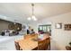 Open-concept dining room with views into the living room and comfortable seating at 1289 Leisure World --, Mesa, AZ 85206