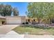 Charming single-story home with a well-manicured front yard, desert landscaping, and covered entryway at 1289 Leisure World --, Mesa, AZ 85206