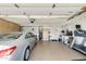 Well-organized garage with storage cabinets, a car, a treadmill and additional amenities at 1289 Leisure World --, Mesa, AZ 85206