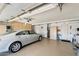 Spacious garage featuring built-in cabinetry for ample storage and a car parked inside at 1289 Leisure World --, Mesa, AZ 85206