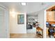 Bright hallway leads to a cozy living room with stylish furniture and a glimpse of the kitchen at 1289 Leisure World --, Mesa, AZ 85206
