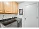 Laundry room featuring modern appliances and ample storage space at 1289 Leisure World --, Mesa, AZ 85206