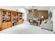 Open living room featuring built-in shelving, neutral-toned furniture, and stylish decor at 1289 Leisure World --, Mesa, AZ 85206