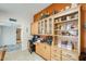 Functional office area with custom cabinetry, built-in shelving, and easy access to the kitchen at 1289 Leisure World --, Mesa, AZ 85206