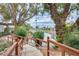 Picturesque view of pond with a wooden bridge and lush green landscaping at 1289 Leisure World --, Mesa, AZ 85206
