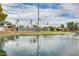 Picturesque community pond and lush landscaping providing recreational opportunities and scenic views at 1289 Leisure World --, Mesa, AZ 85206
