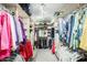 Spacious walk-in closet with custom shelving and ample storage for clothes and accessories at 1289 Leisure World --, Mesa, AZ 85206