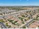 A suburban neighborhood next to a highway, showcasing homes with tile roofs and landscaped yards at 1360 S Camellia Ct, Chandler, AZ 85286