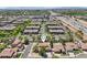 A beautiful aerial view showcasing community homes and proximity to the highway, highlighted with a location pin at 1360 S Camellia Ct, Chandler, AZ 85286