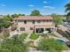 Aerial shot showcases the home's backyard with a refreshing pool and patio, perfect for relaxation at 1360 S Camellia Ct, Chandler, AZ 85286