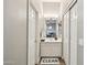 Hallway view of bathroom with vanity and mirror; showcasing the layout and design at 1360 S Camellia Ct, Chandler, AZ 85286