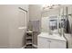 Bathroom with white vanity, a framed mirror, and a window over the counter for natural light at 1360 S Camellia Ct, Chandler, AZ 85286