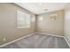 Neutral bedroom featuring plush gray carpeting and bright natural light at 1360 S Camellia Ct, Chandler, AZ 85286