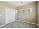 Neutral bedroom with gray carpet and a closet with sliding doors at 1360 S Camellia Ct, Chandler, AZ 85286