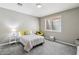 Bedroom with a comfortable bed, neutral decor, and a bright window providing natural light at 1360 S Camellia Ct, Chandler, AZ 85286